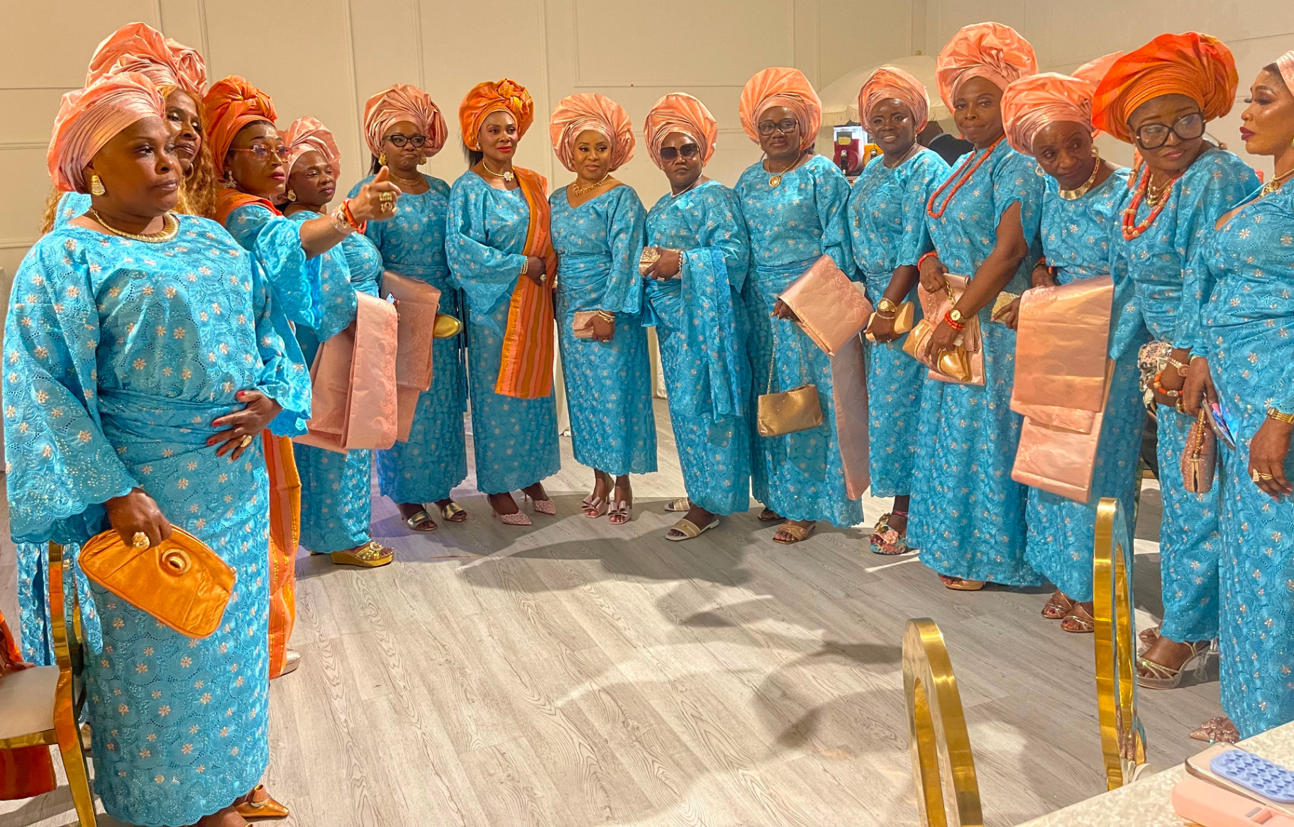 ECAT members in elegant turquoise and peach traditional attire
